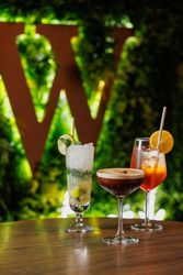 Cocktails with W sign in background