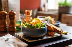 prawn salad in a dish with a side of bread