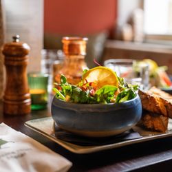 prawn salad in a dish with a side of bread