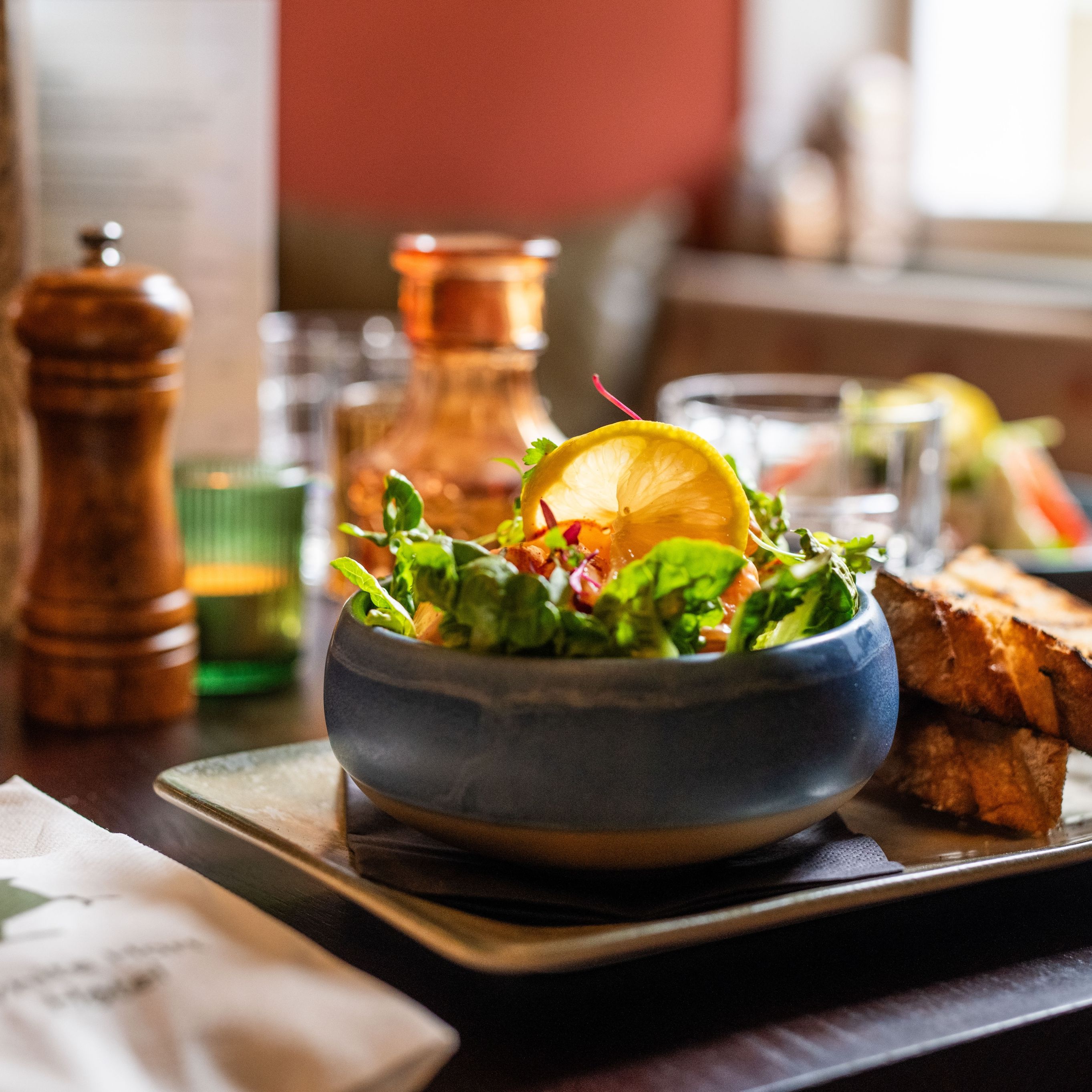 prawn salad in a dish with a side of bread