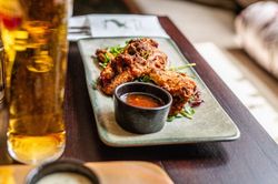 chicken goujons on a plate with sweet chilli sauce