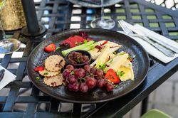cheese platter with grapes and celery