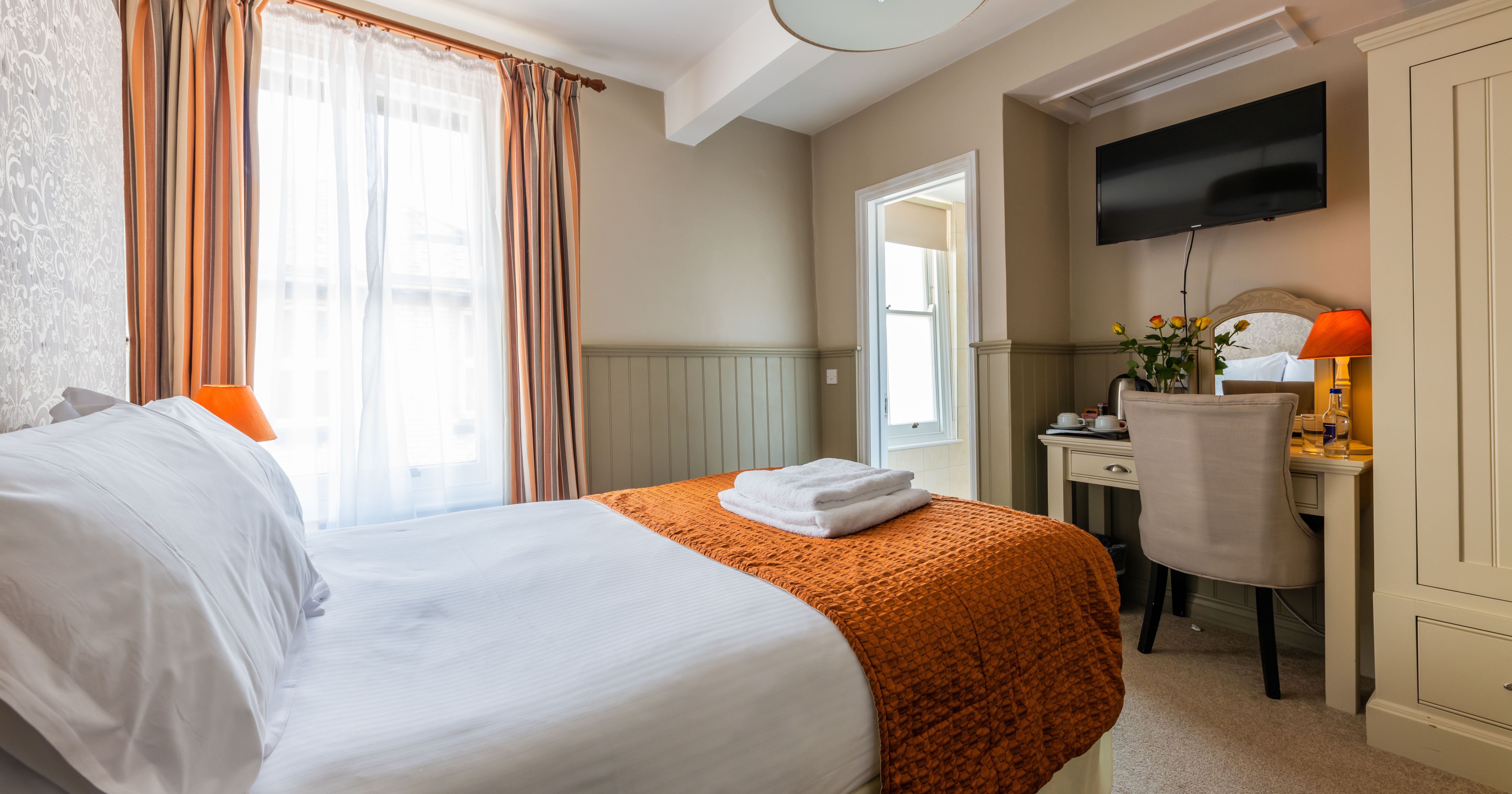 cosy double bedroom with flat screen tv