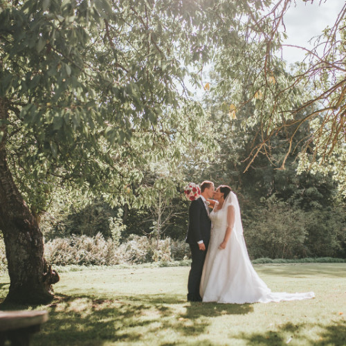 Bride and groom in gardens