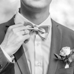 Groom with bowtie and flowers in pocket