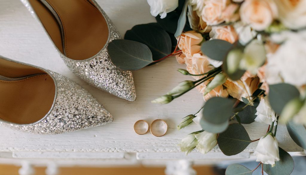 Wedding shoes, rings and flowers