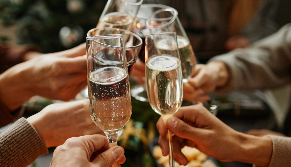 People toasting with champagne glasses at a celebration
