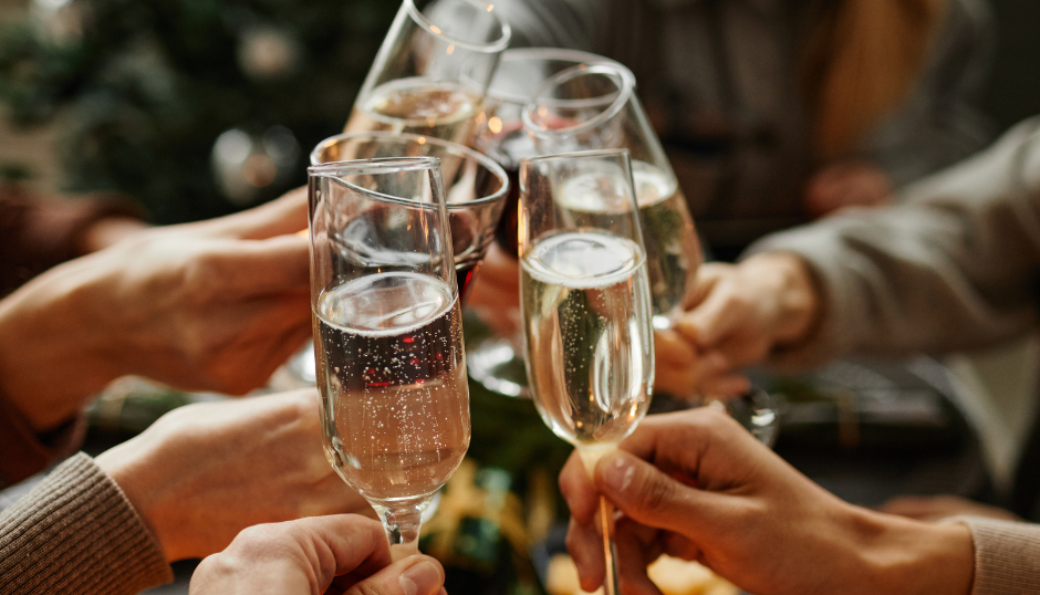 People toasting with champagne glasses at a celebration