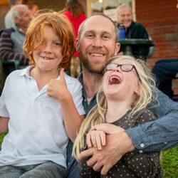 Children smiling at outdoor theatre
