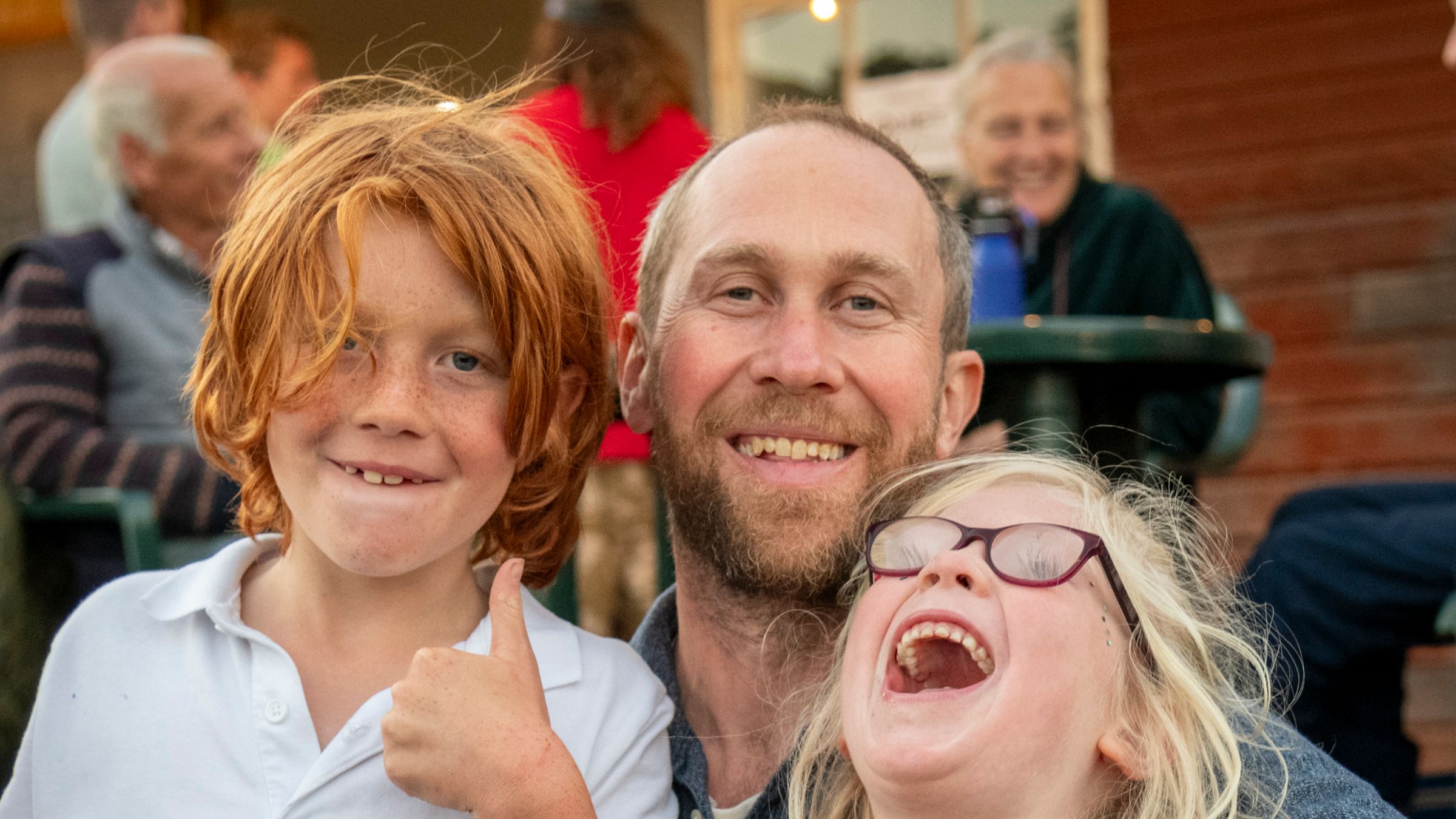 Children smiling at outdoor theatre
