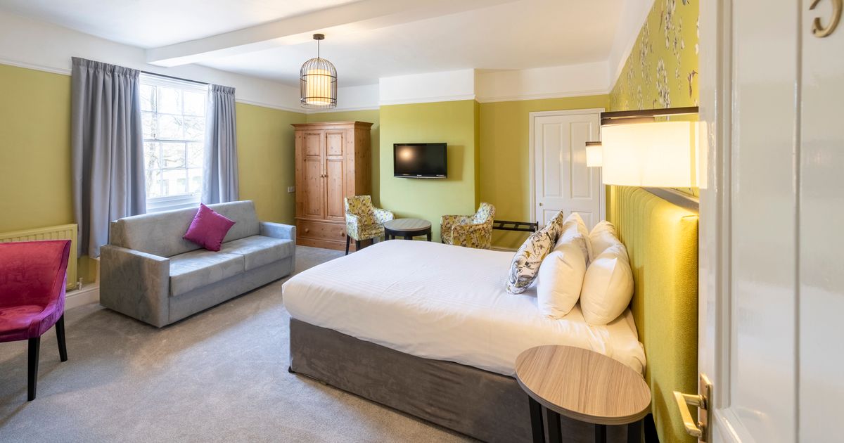 Large room with sofa and double bed