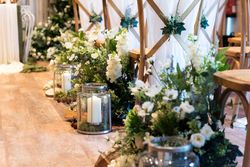 Green and White flower table center pieces with candles