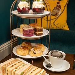 Afternoon tea with sandwiches, cakes and scones