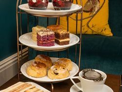 Afternoon tea with sandwiches, cakes and scones