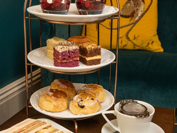 Afternoon tea with sandwiches, cakes and scones