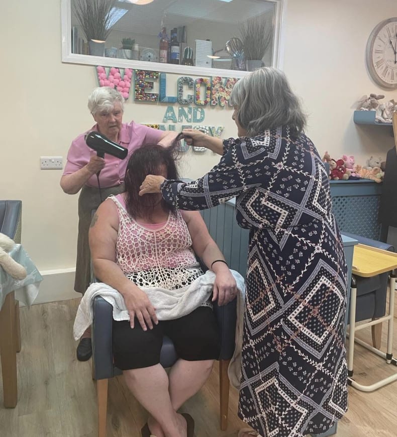 Residents doing hairdressing