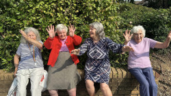 Ladies sitting on a wall