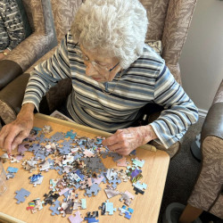 Woman doing puzzle