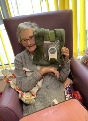 Lady opening Christmas Presents