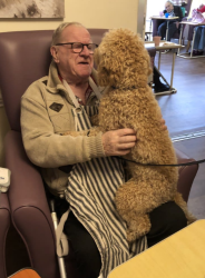 Man with Dog on his lap