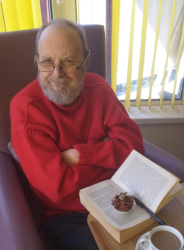 Man with his book and a cup of tea