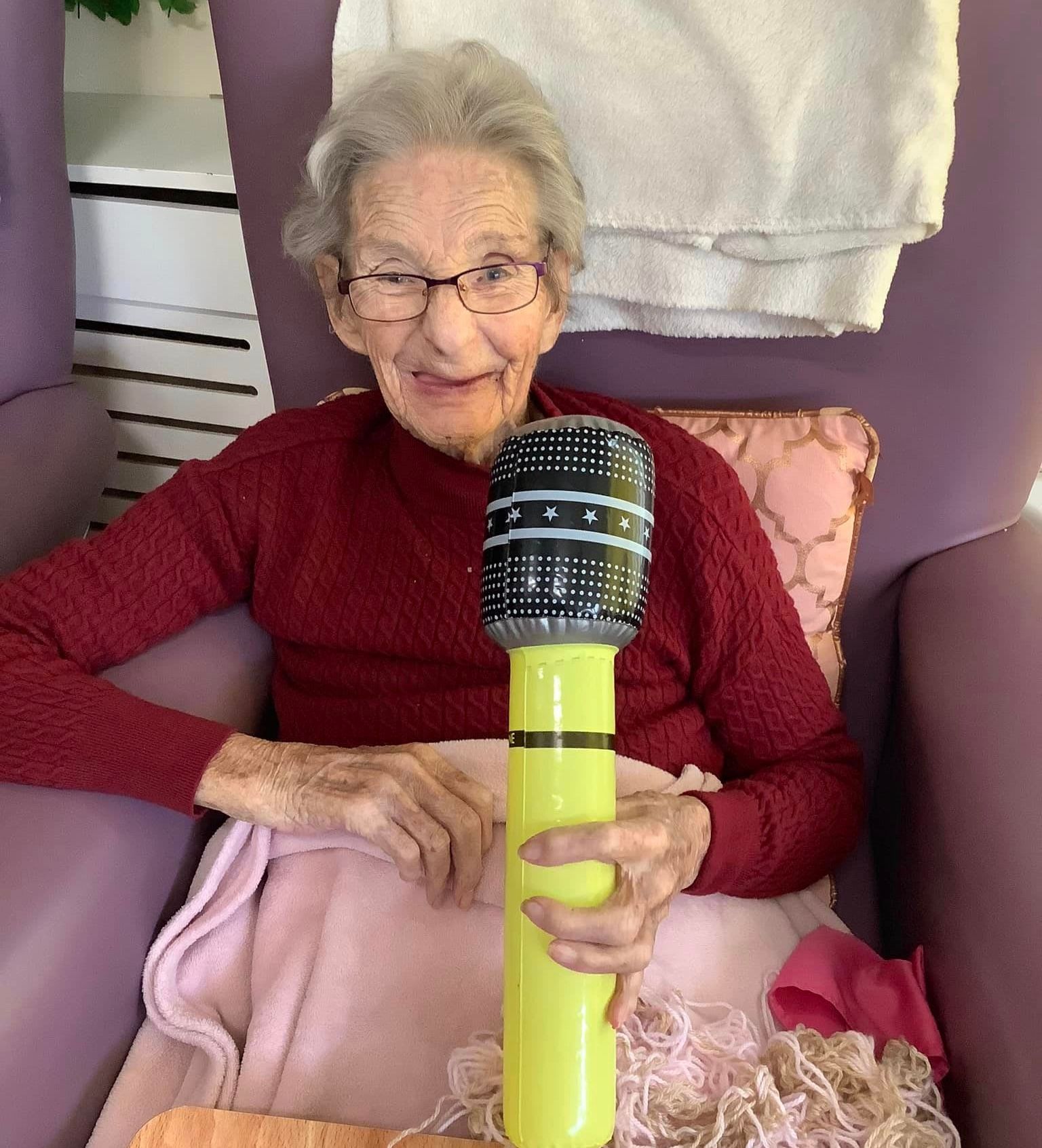 Lady with inflatable microphone