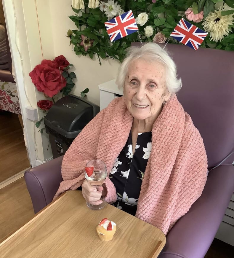 Lady with wine and cake