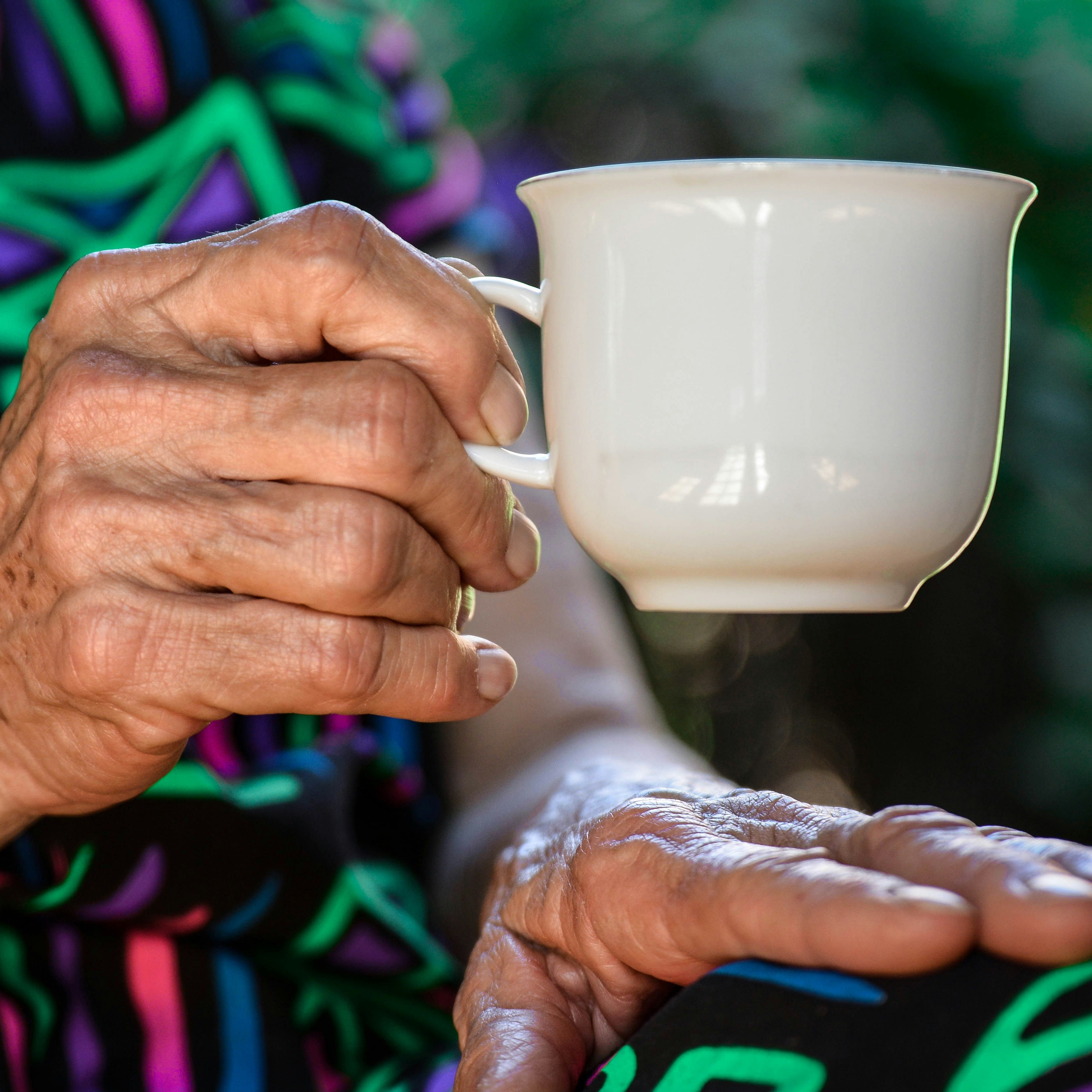 Holding a cup of tea