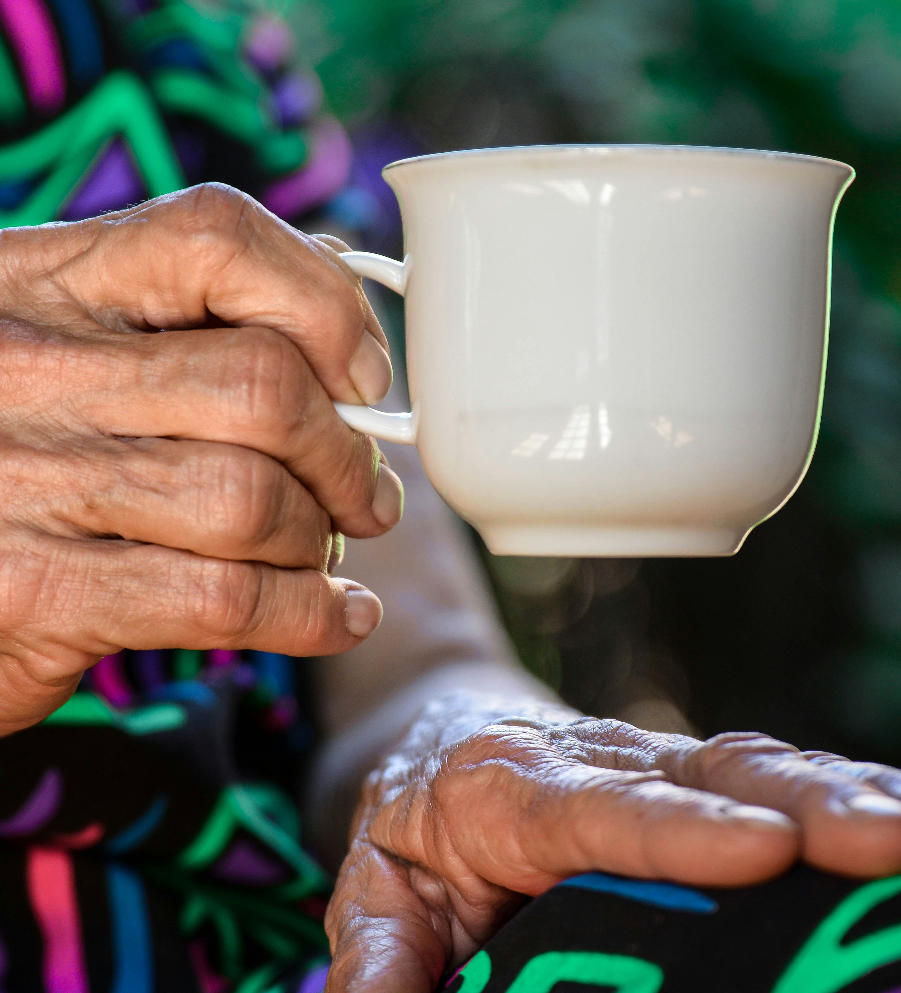Holding a cup of tea