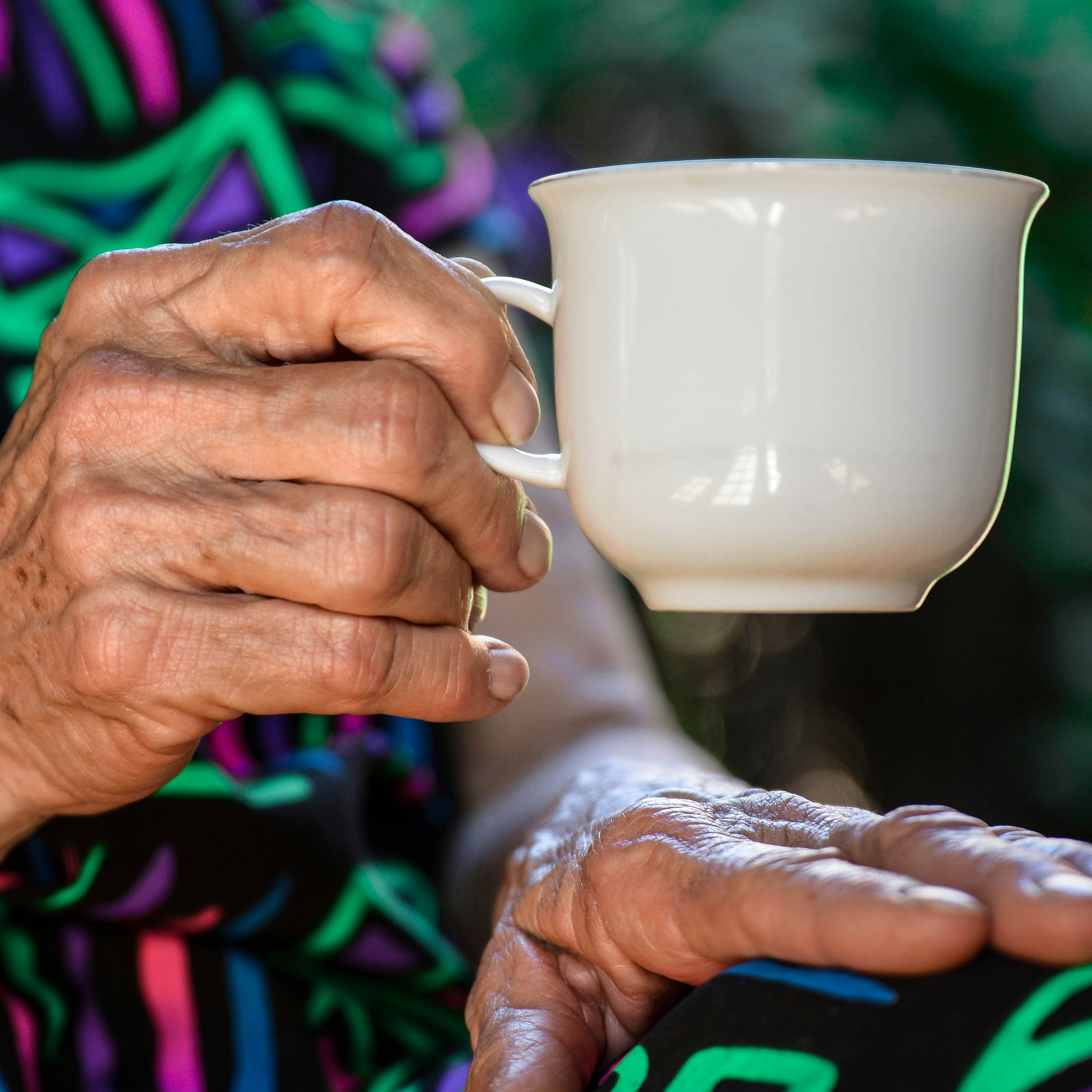 Holding a cup of tea