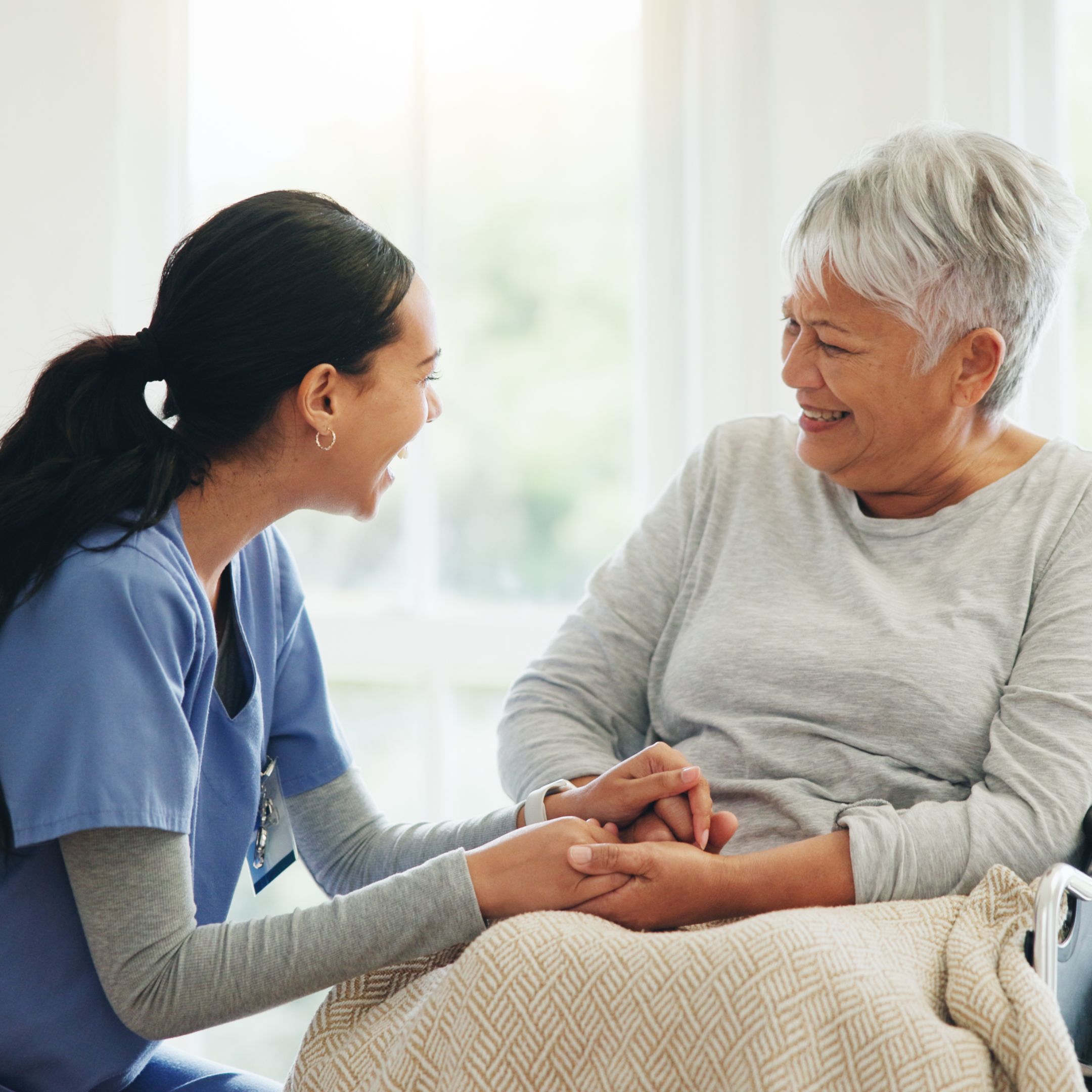 nurse-and-resident-happily-chatting.jpg