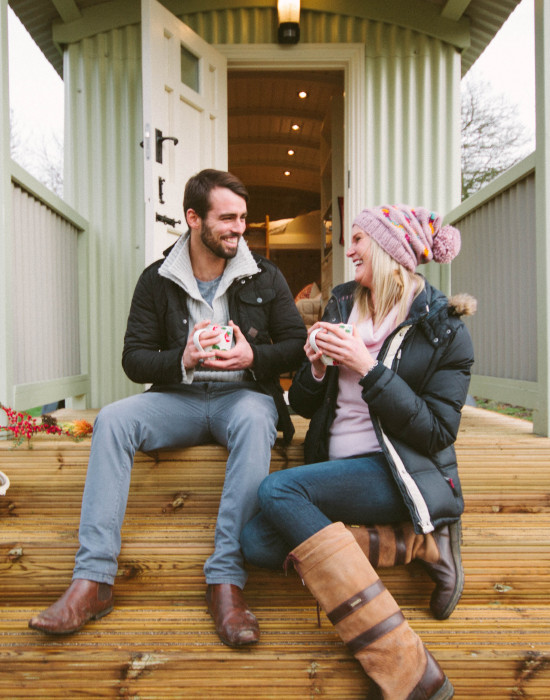 People sat outside the snug hut
