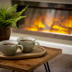 Tea cups, plant and fire