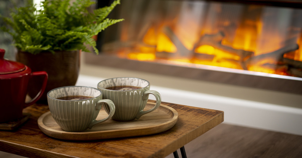Tea cups, plant and fire