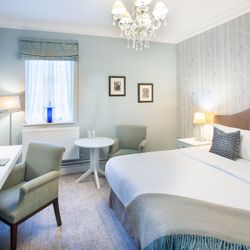 Bedroom with dressing table and large bed