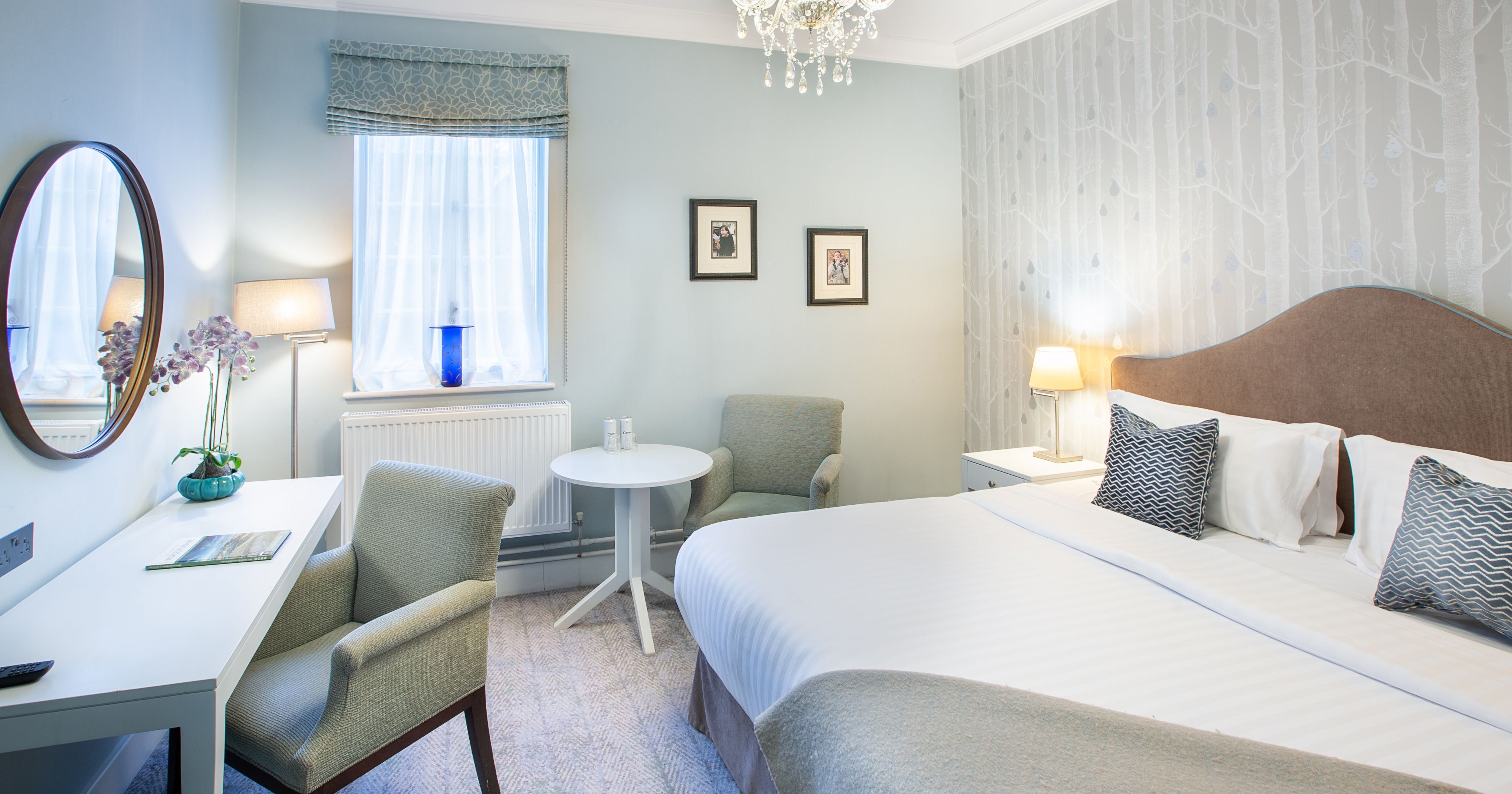 Bedroom with dressing table and large bed