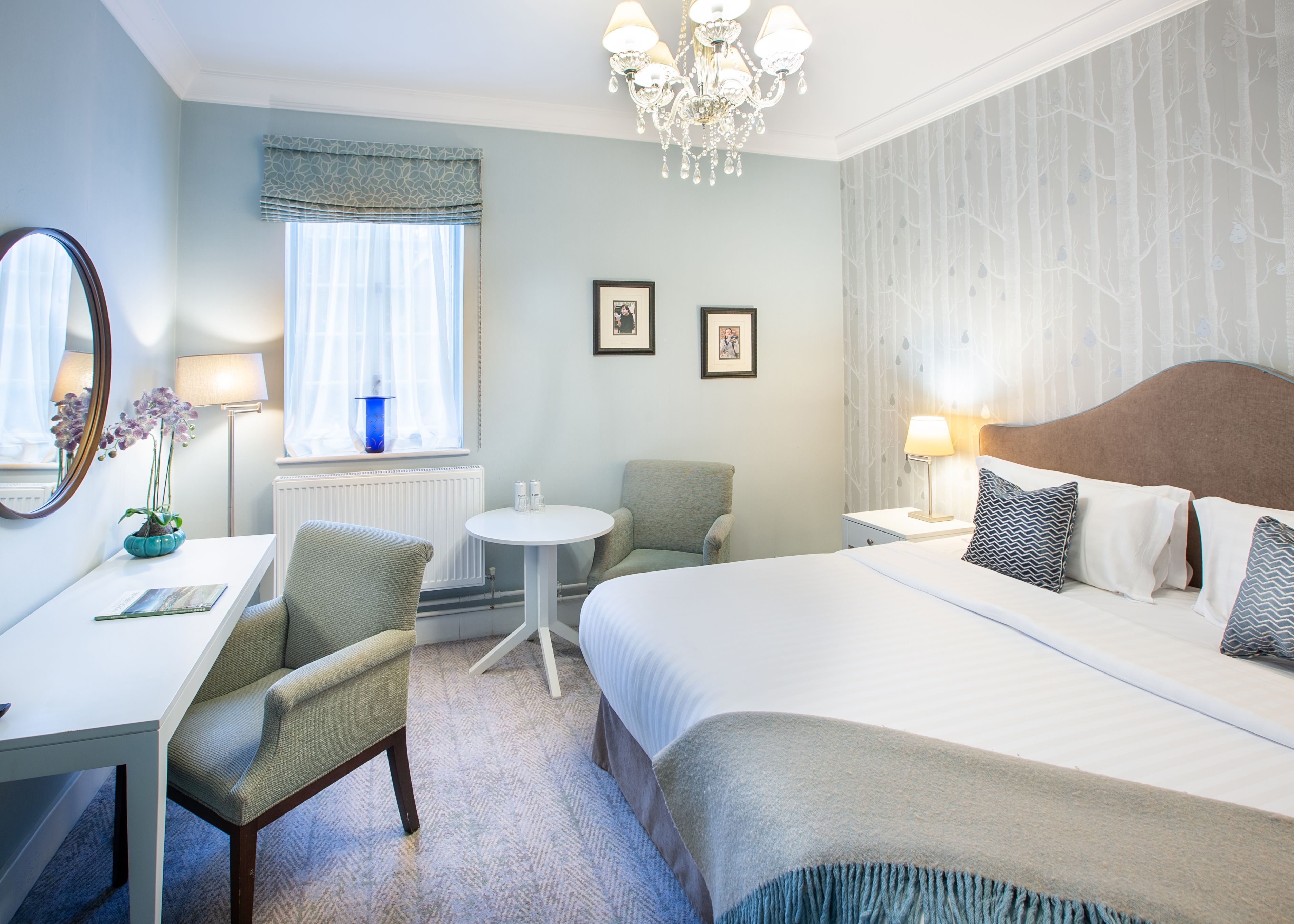Bedroom with dressing table and large bed