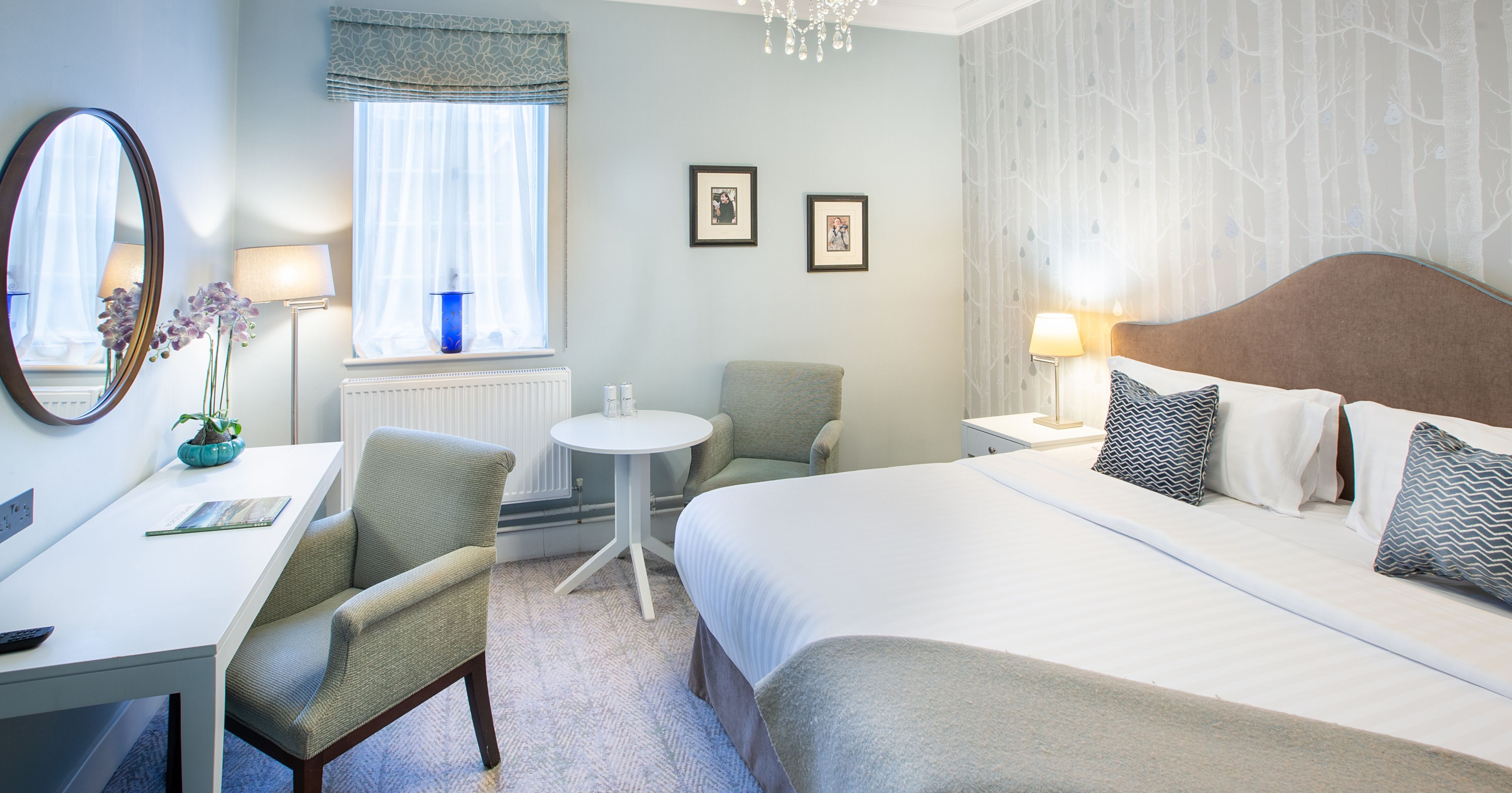 Bedroom with dressing table and large bed