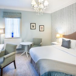 Bedroom with dressing table and large bed