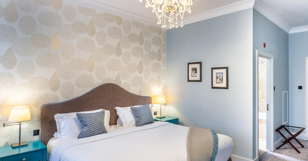 Bedroom with dressing table and large bed