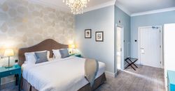 Bedroom with dressing table and large bed