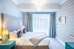Bedroom with accessible door ways and accessible bathroom