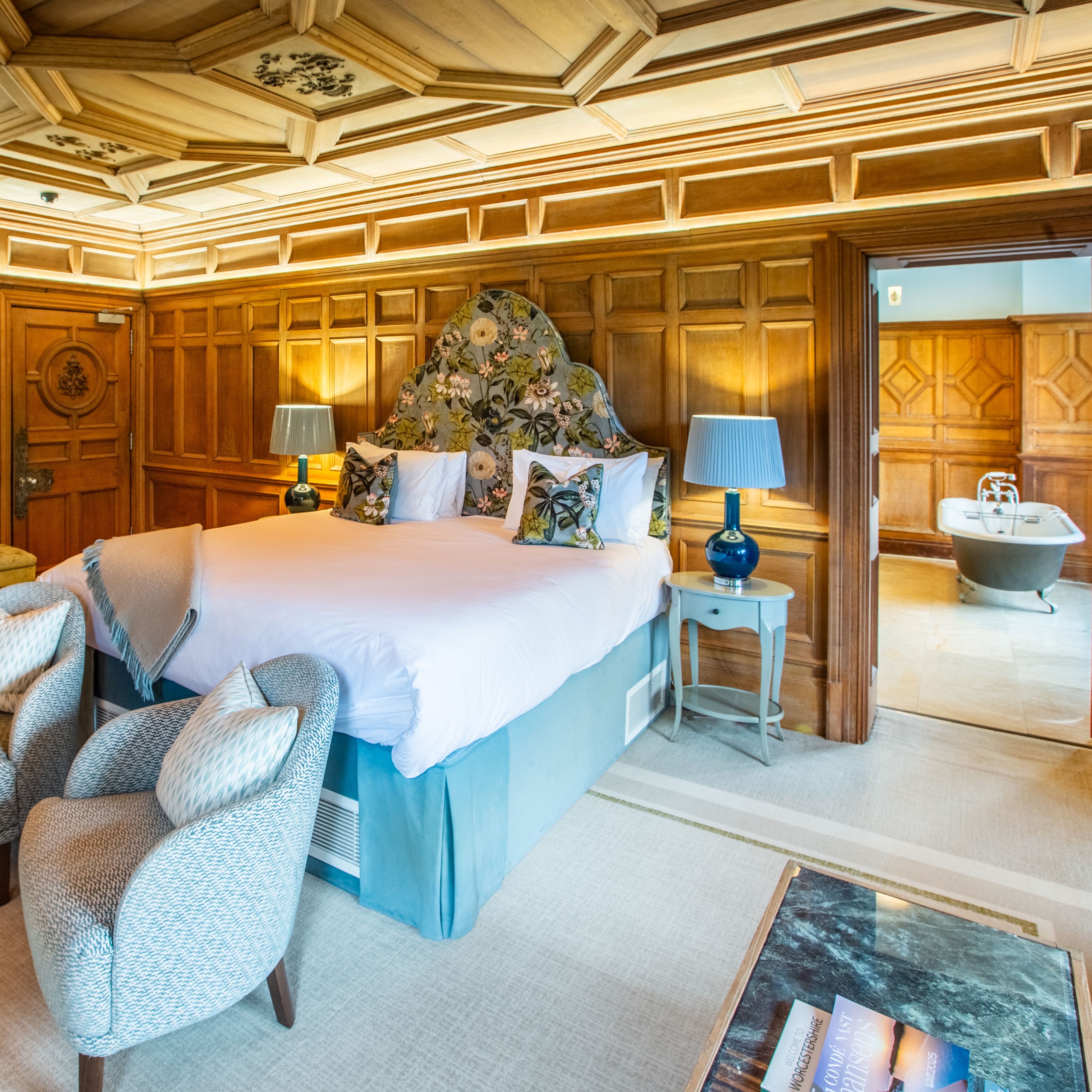 Luxury Room with two seats in front of bed