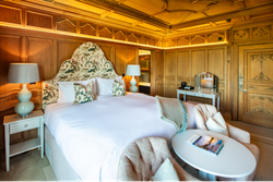 Large Kings size bed with two chairs infront