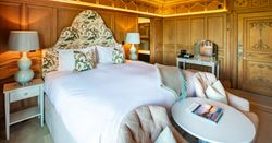 Large Kings size bed with two chairs infront