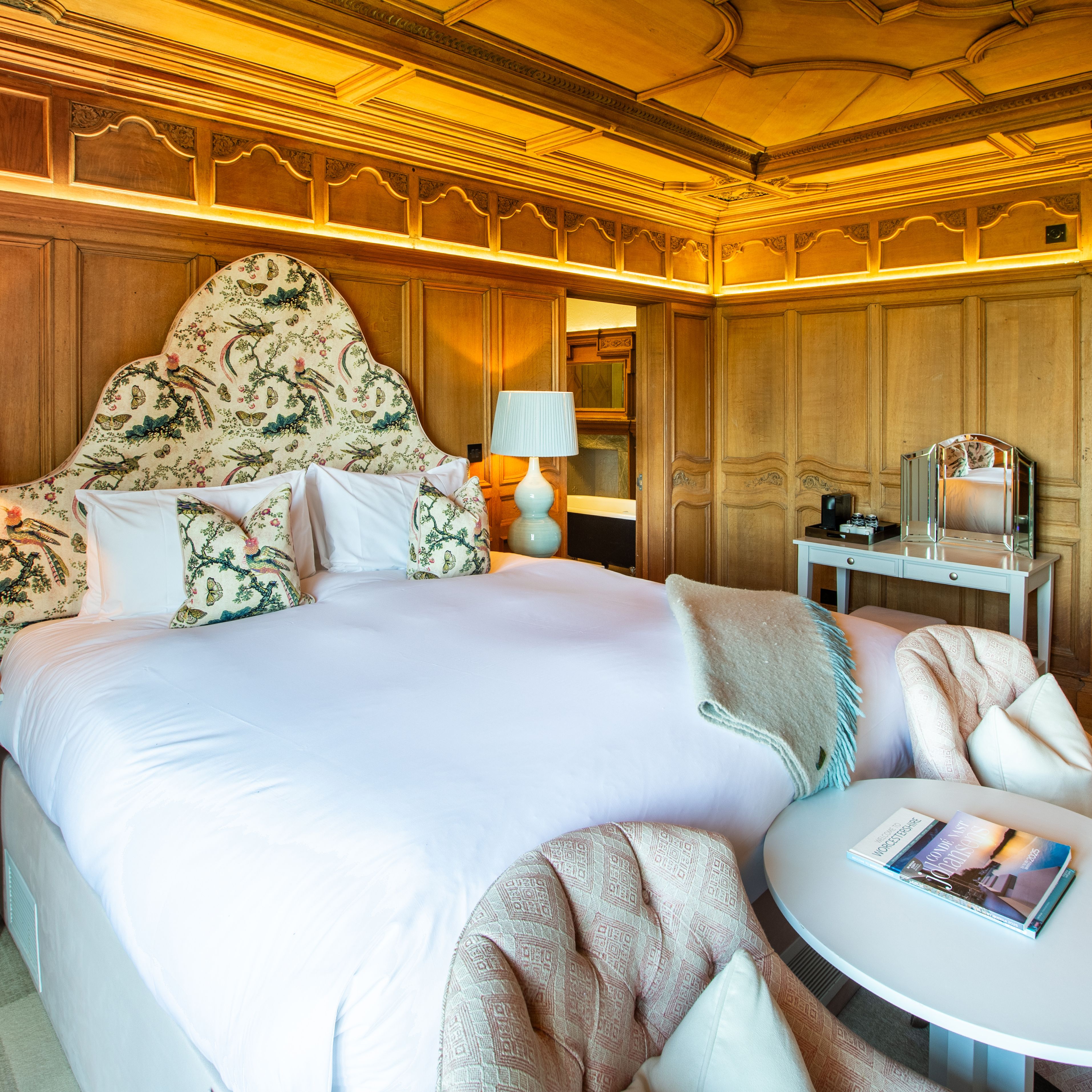 Large Kings size bed with two chairs infront