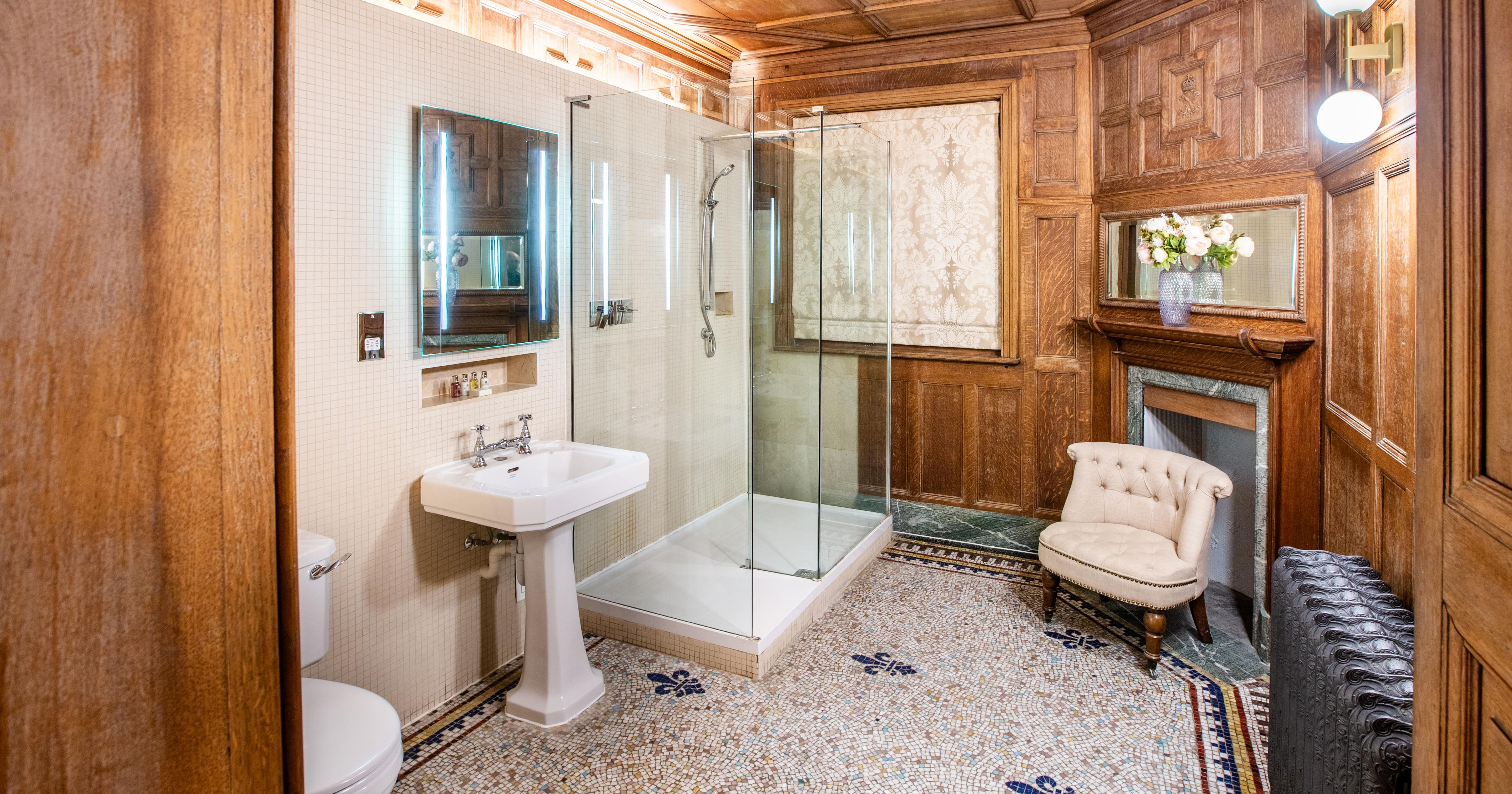 Bathroom with tiled floor and panelled wood walls