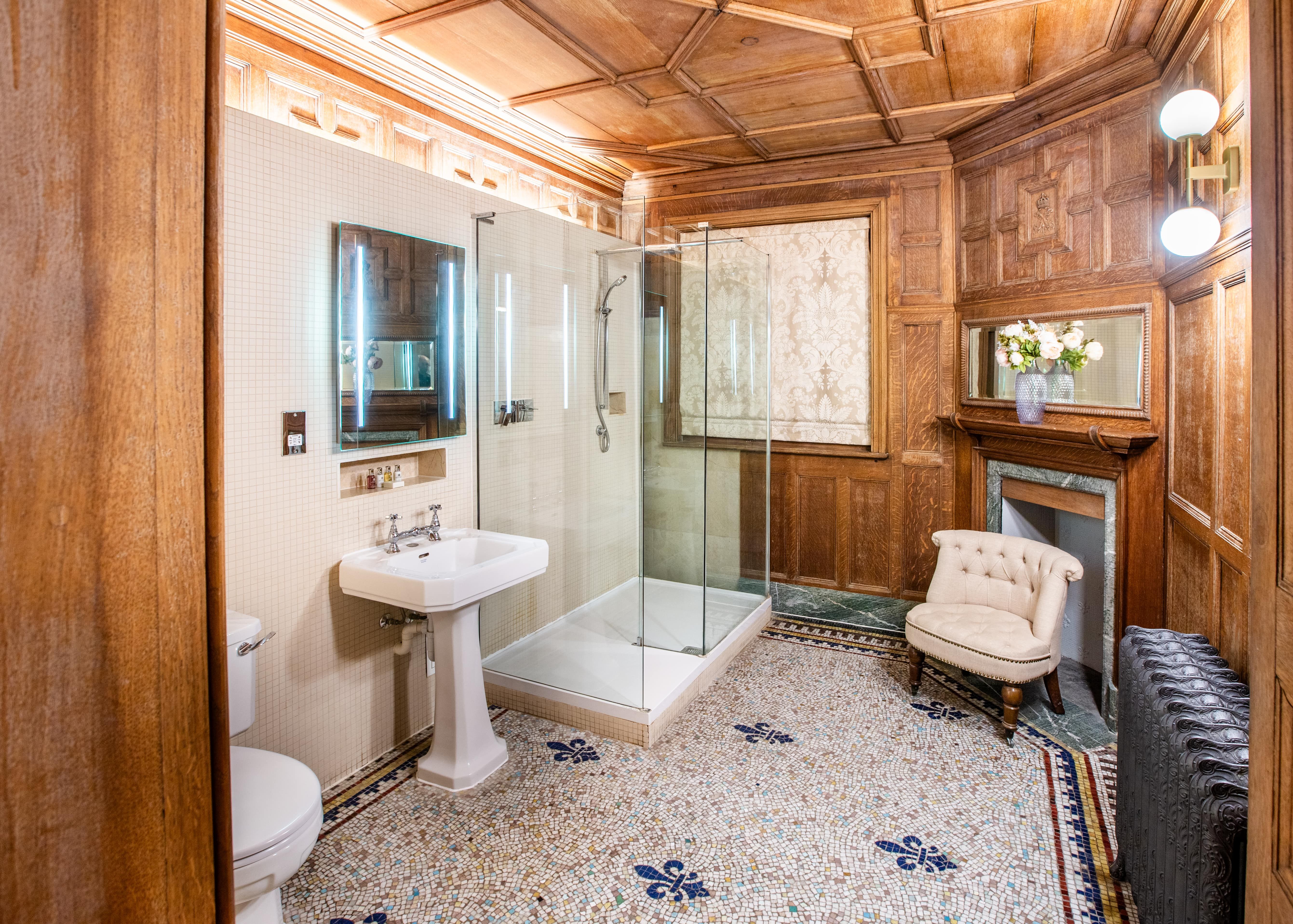 Bathroom with tiled floor and panelled wood walls