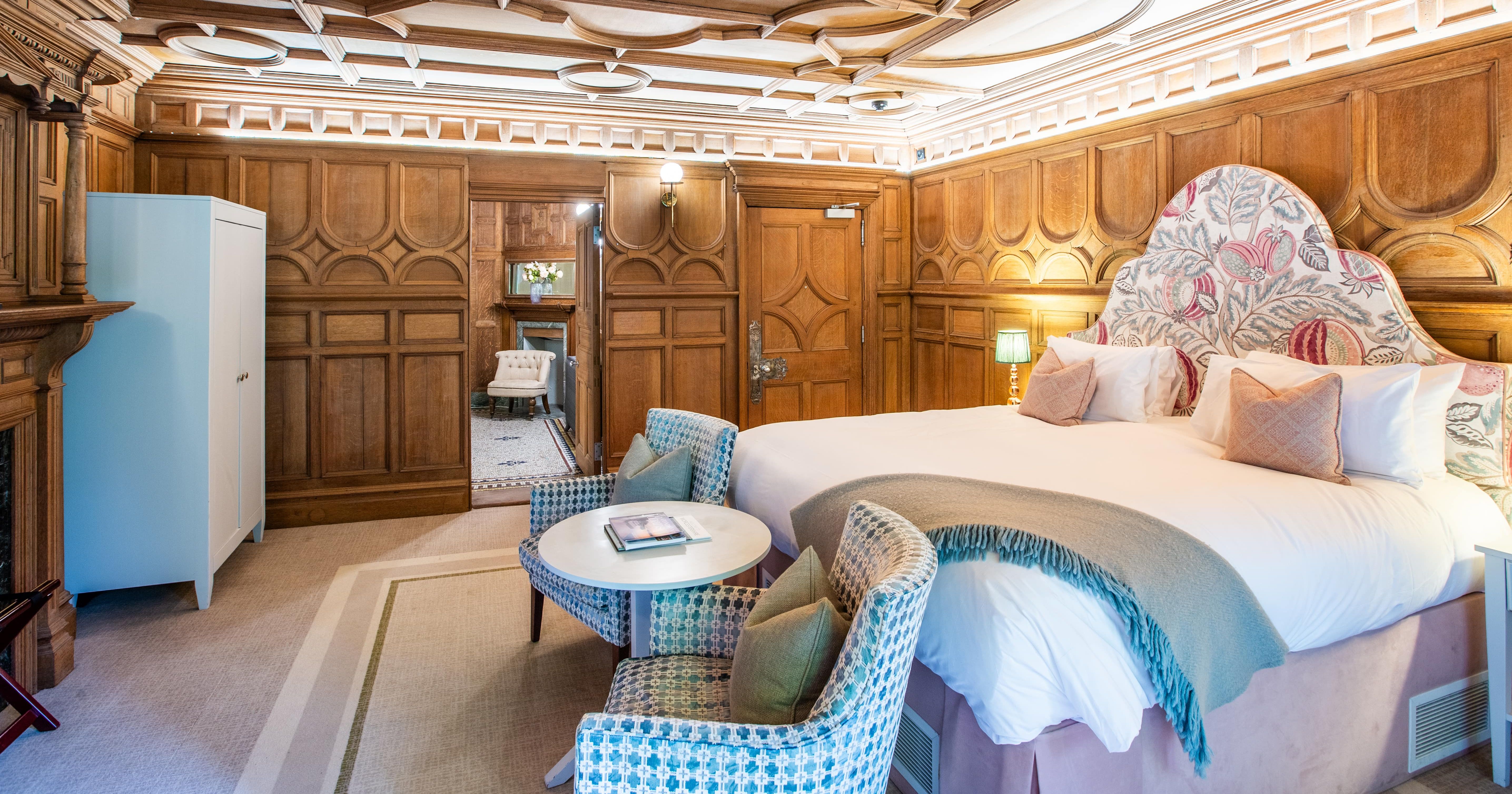 Bedroom with wooden panelled walls