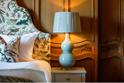 Bedroom with wood panelled walls